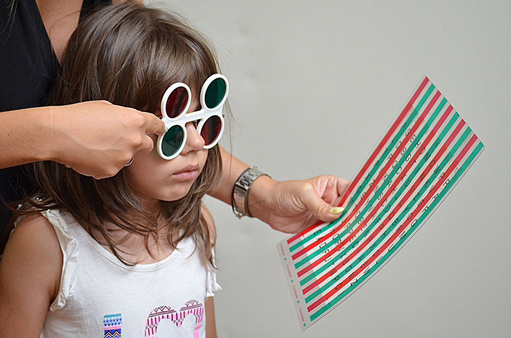 girl with red green glasses